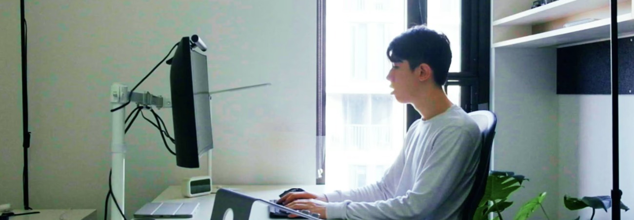 Jamie writing at his desk